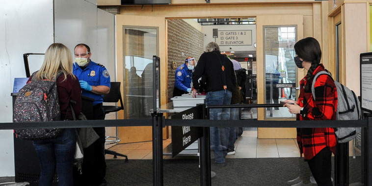 Travelers head through a TSA checkpoint at the Idaho Falls Regional Airport on Nov. 24, 2020.