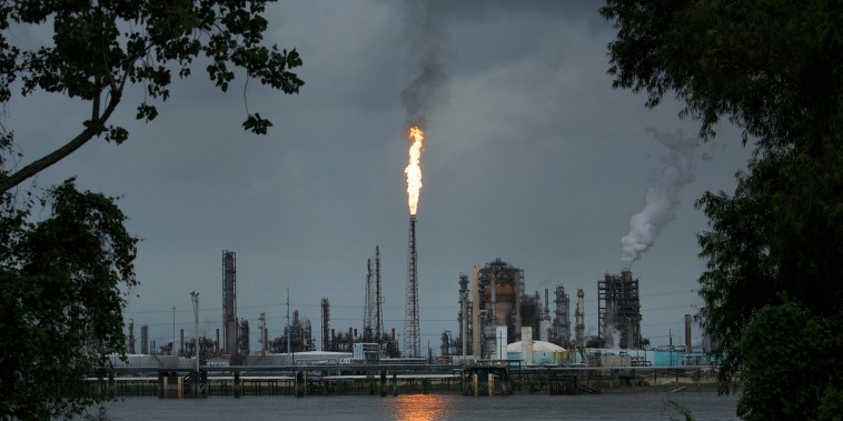 A gas flare from the Shell Chemical LP petroleum refinery illuminates the sky in Norco, La., on Aug. 21, 2019.
