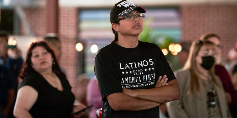 A man with a "Latinos for America First" t-shirt