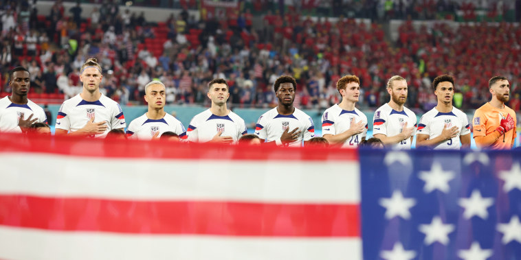The USA team during the national anthem before their match against Wales in Ar-Rayyan, Qatar, on Nov. 21, 2022.