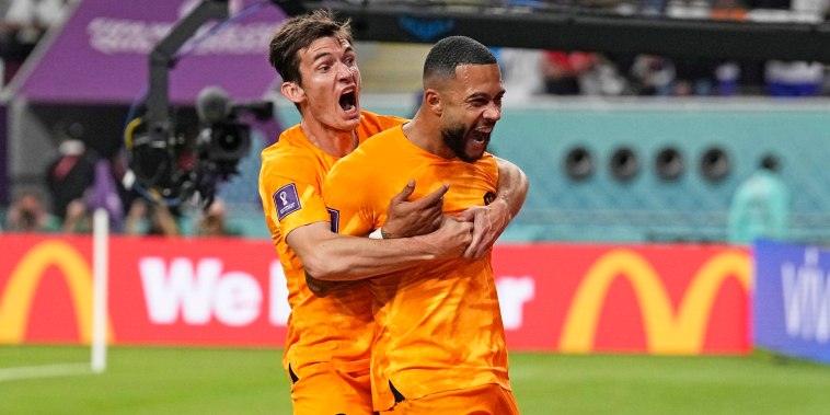 Memphis Depay of the Netherlands, right, celebrates after scoring the opening goal