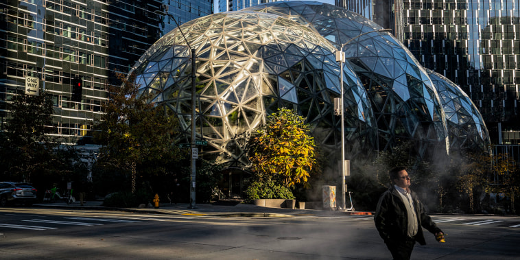Image:  A man walks by The Spheres at the Amazon.com Inc. headquarters on Nov. 14, 2022 in Seattle, Wash.