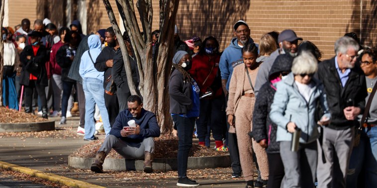 Voters line up to cast their ballots on Nov. 26, 2022, in Decatur, Ga.