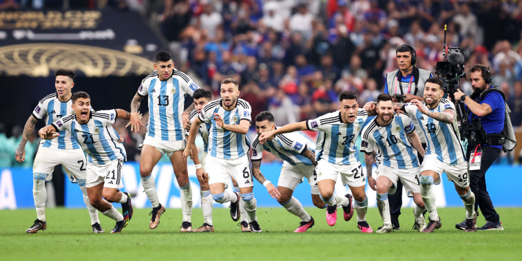 Argentina players celebrate the fourth and winning penalty by Gonzalo Montiel in the penalty shootout during the World Cup final against France on Dec. 18, 2022, in Lusail City, Qatar.