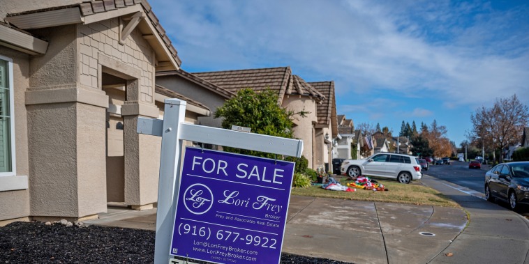 A "For Sale" sign in front of a home in Roseville, Calif., on Dec. 6, 2022. 