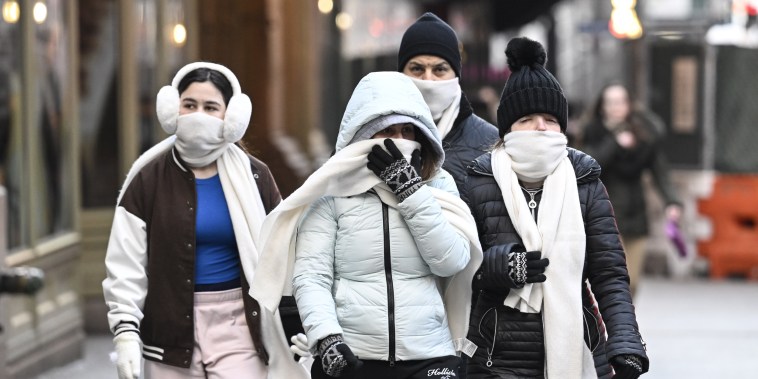 People walk on the street in New York, on Dec. 25, 2022.