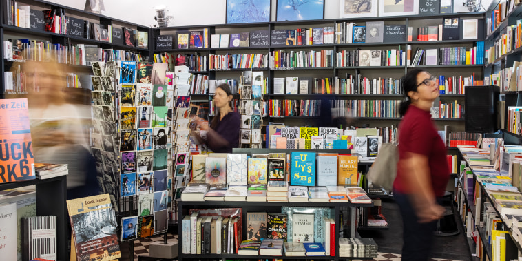 Interior of a bookstore with customers.