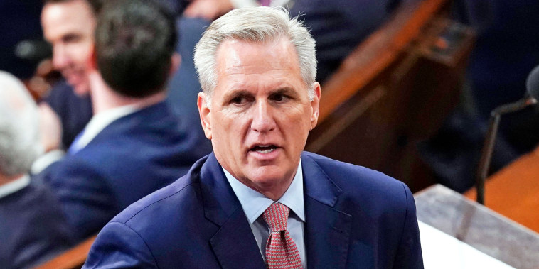 Rep. Kevin McCarthy stands on the floor during the opening day of the 118th Congress