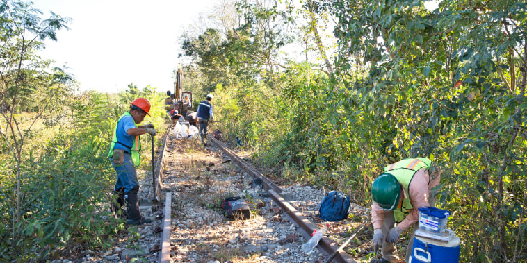 Tren Maya workers rip up old rails in the community of La Chiquita, Mexico