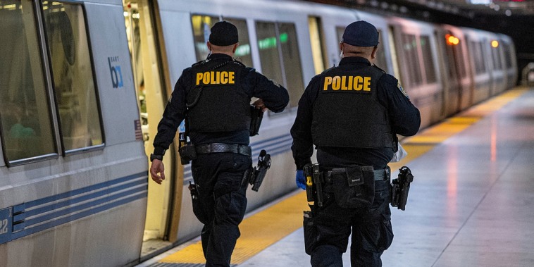 Police officers inside the Bay Area Transit (BART) Embarcadero station in San Francisco on Oct. 10, 2022. 
