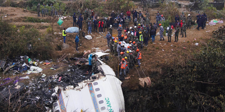 Nepal began a national day of mourning Monday as rescue workers resumed the search for six missing people a day after a plane to a tourist town crashed into a gorge while attempting to land at a newly opened airport, killing at least 66 of the 72 people aboard in the country's deadliest airplane accident in three decades.