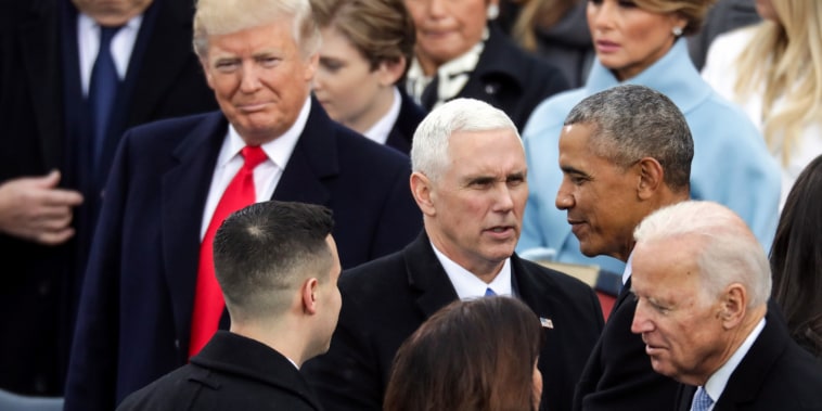 President-elect Donald Trump looks on as President Barack Obama and former Vice President Joe Biden congratulate Vice President Mike Pence after he took the oath of office on Jan. 20, 2017.