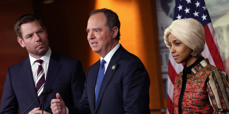 Image: Rep. Adam Schiff joined by Rep. Eric Swalwell and Rep. Ilhan Omar speaks at a press conference.