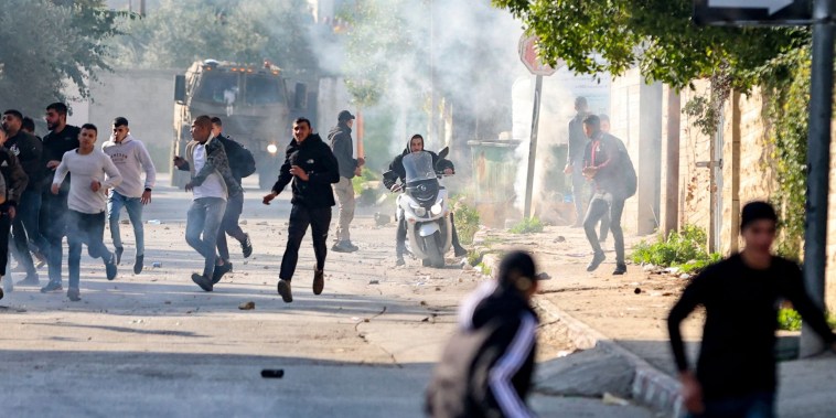 An Israeli raid on the West Bank's Jenin refugee camp today killed four Palestinians including an elderly woman, Palestinian officials said, also accusing the army of using tear gas inside a hospital.