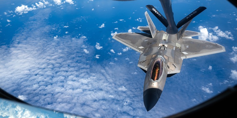 A 199th Fighter Squadron F-22A Raptor approaches a 909th Air Refueling Squadron KC-135 Stratotanker over the East China Sea June 8, 2022. The 199th FS conducted agile combat employment operation in the Pacific to strengthen the readiness and interoperability needed to defend Japan and ensure a free and open Indo-Pacific. (U.S. Air Force photo by Senior Airman Stephen Pulter)