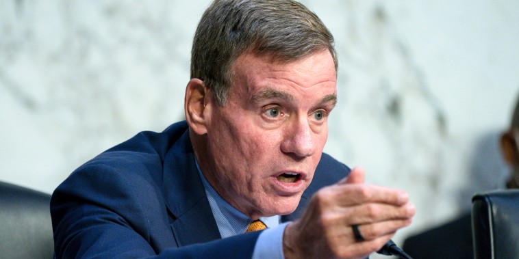 Sen. Mark Warner, D-Va., questions the panel during a Senate Banking Committee annual Wall Street oversight hearing on Sept. 22, 2022.