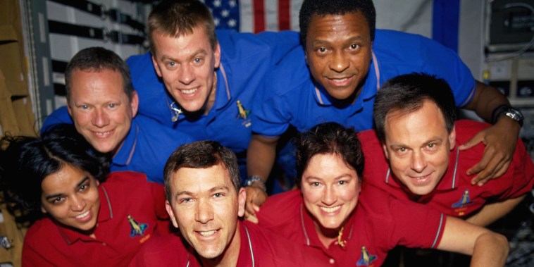 Space Shuttle Columbia Crewmembers Strike A Flying Pose