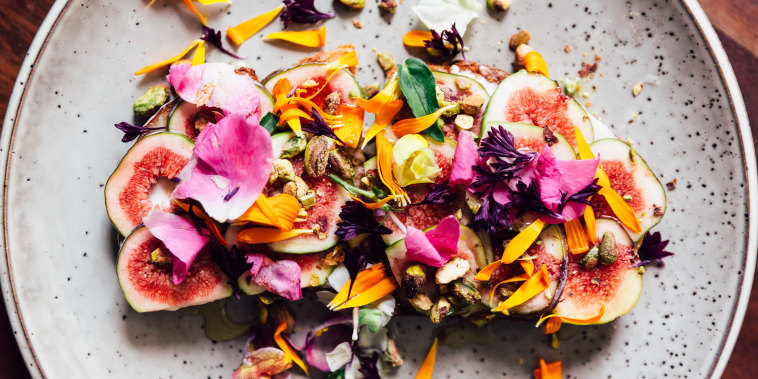 Fig toast with edible flowers, directly above view