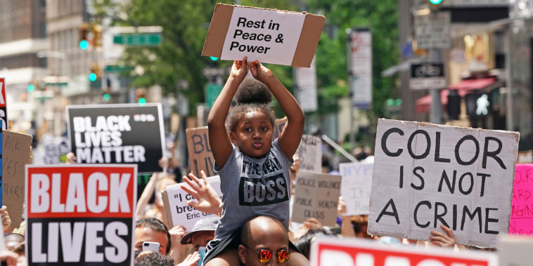 A girl holds up a sign during a Black Lives Matter protest in New York