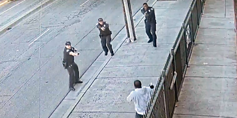 Huntington Park police aim their weapons at Anthony Lowe last month.