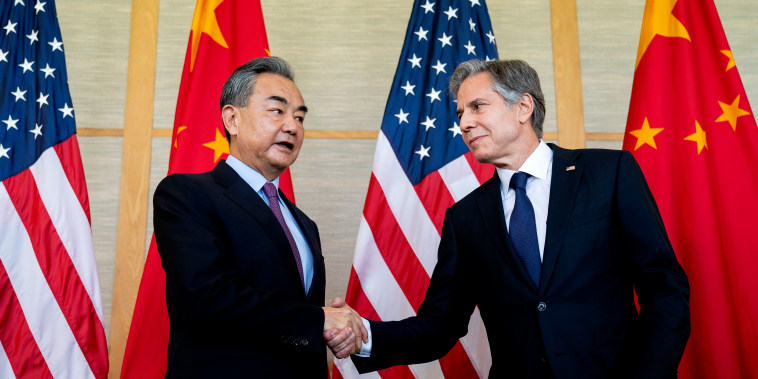 Secretary of State Blinken, right, shakes hands with China's Foreign Minister Wang Yi during a meeting on the Indonesian resort island of Bali on July 9, 2022.