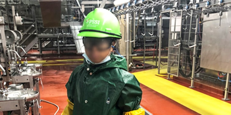 A Department of Labor investigator photographed a child who worked for Packers Sanitation Services Inc. (PSSI) cleaning a slaughterhouse in Grand Island, Nebraska. The subject has been blurred by the source.