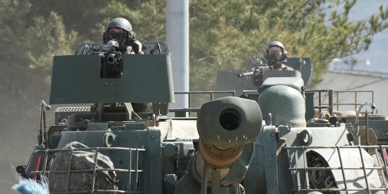 South Korean army soldiers move K-5 self-propelled howitzers in Yeoncheon, South Korea, near the border with North Korea, on Monday.