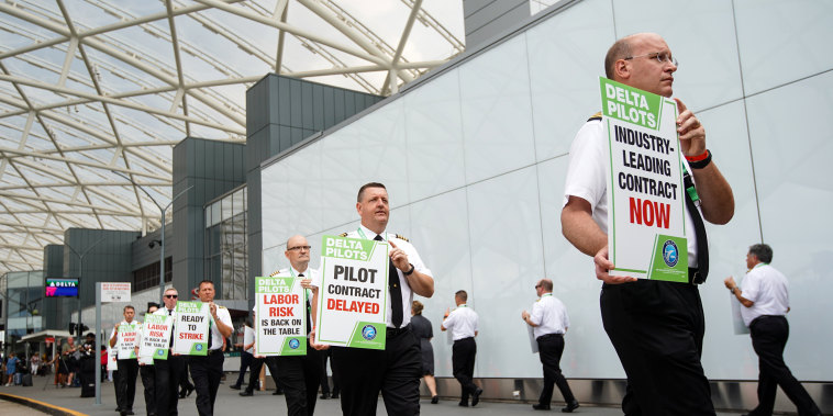Delta Air Lines pilots during a nationwide protest against the union contract at Atlanta Hartsfield-Jackson International Airport on June 30, 2022.