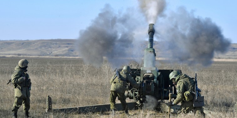 A Russian artillery unit fires a D-30 howitzer toward Ukrainian positions on Jan. 26, 2023.