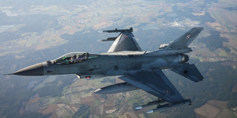 A F-16 Fighting Falcon flies during a NATO air shielding exercise in Lask, Poland