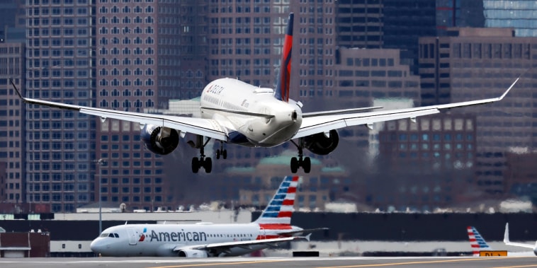 A plane lands at Logan International Airport
