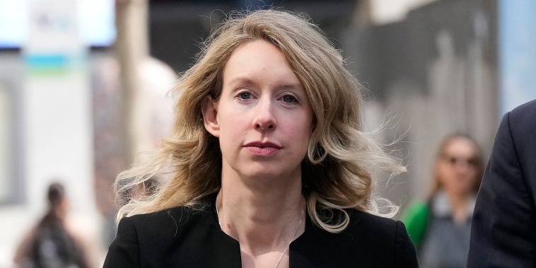 Former Theranos CEO Elizabeth Holmes leaves federal court in San Jose, Calif., Friday, March 17, 2023. 