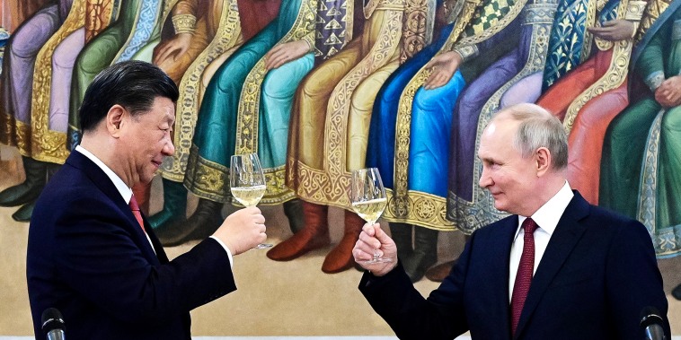 Russian President Vladimir Putin, right, and Chinese President Xi Jinping toast during their dinner at The Palace of the Facets, a building in the Moscow Kremlin, Russia, Tuesday, March 21, 2023. (Pavel Byrkin, Sputnik, Kremlin Pool Photo via AP)