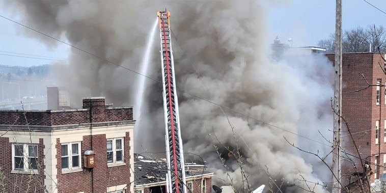 Firefighters work to extinguish a fire in West Reading, Pa., on Friday.