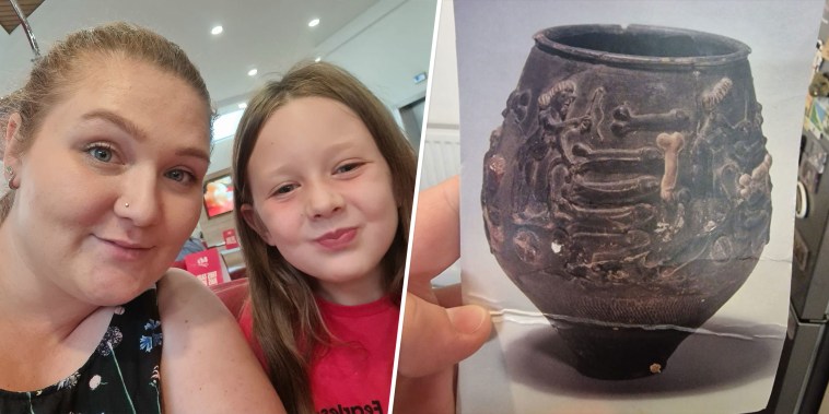 Rebecca Fisher and daughter with postcard of vase