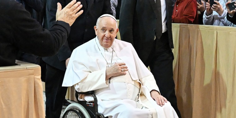 Pope Francis arrives in a wheelchair 
