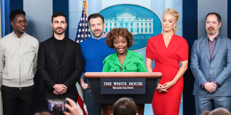 Toheeb Jimoh, Brett Goldstein, Jason Sudeikis, Hannah Waddingham, and Brendan Hunt from "Ted Lasso" with White House Press Secretary Karine Jean-Pierre as they speak about "the importance of addressing mental health to promote overall well-being" in the press briefing at the White House in Washington, DC on March 20 2023.