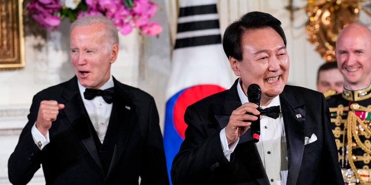 President Joe Biden reacts as South Korea's President Yoon Suk Yeol sings the song American Pie by Don Mclean at the White House on April 26, 2023.