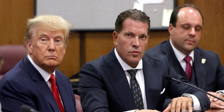 NEW YORK, NY - APRIL 04:  Former U.S. President Donald Trump sits with his attorneys Joe Tacopina and Boris Epshteyn inside the courtroom during his arraignment at the Manhattan Criminal Court April 4, 2023 in New York City. Trump pleaded not guilty to 34 felony counts stemming from hush money payments made to adult film star Stormy Daniels before the 2016 presidential election. With his indictment, Trump will become the first former U.S. president in history to be charged with a criminal offense.