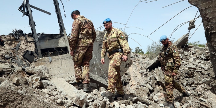 Italian U.N. peacekeeper soldiers inspect a small bridge that was destroyed by an Israeli airstrike, in Maaliya village, Lebanon
