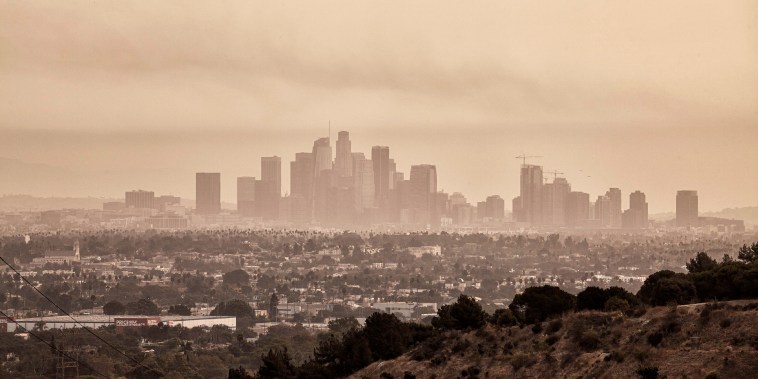 In early September 2020, Los Angeles was blanketed each day with smoke and ash from nearby wildfires. Downtown Los Angeles from Baldwin Hills Scenic Overlook. California, USA. (Photo by: Citizen of the Planet//Education Images/Universal Images Group via Getty Images)