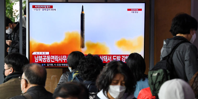 People a news broadcast with file footage of a North Korean missile test at a railway station in Seoul, South Korea, on April 13, 2023.