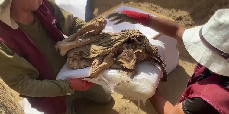 Peruvian archaeologists unearthed a more than 1,000-year-old mummy on the outskirts of the modern capital on April 24, in the latest discovery dating back to pre-Inca times.