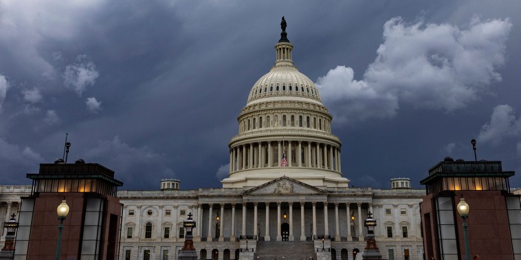 Storm clouds over a wide shot of the Capitol building.