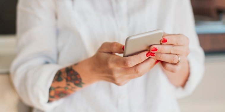 Woman holding cell phone