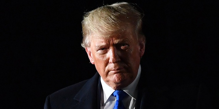 President Donald Trump gestures after disembarking from Air Force One after landing at Stansted Airport, northeast of London on December 2, 2019, as they arrive ahead of the upcoming NATO alliance summit. - NATO marks its 70th birthday at a summit next week but the celebration could well turn into an arena of political combat between the alliance's feuding leaders. Heads of state and government will descend on London Tuesday bracing for a scrap over spending and how to deal with Russia, in a huge test of unity within NATO -- billed by its own officials as the "most successful alliance in history".