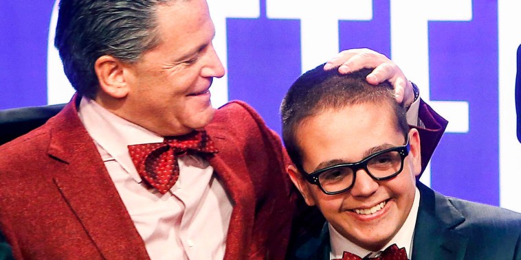 Cleveland Cavaliers owner Dan Gilbert congratulates his son, Nick Gilbert, after the team won the NBA basketball draft lottery in New York on May 21, 2013.