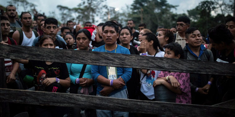 Image: Migrants who plan to start walking across the Darien Gap from Colombia to Panama in hopes of reaching the U.S. gather at the trailhead camp in Acandi, Colombia, on May 9, 2023. 
