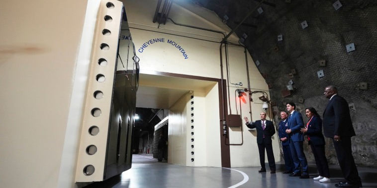 Defense Secretary Lloyd J. Austin III, Canadian Minister of National Defense Anita Anand, Canadian Prime Minister Justin Trudeau and U.S. Air Force Gen. Glen VanHerck at the Cheyenne Mountain Space Force Station facility in Colorado Springs.