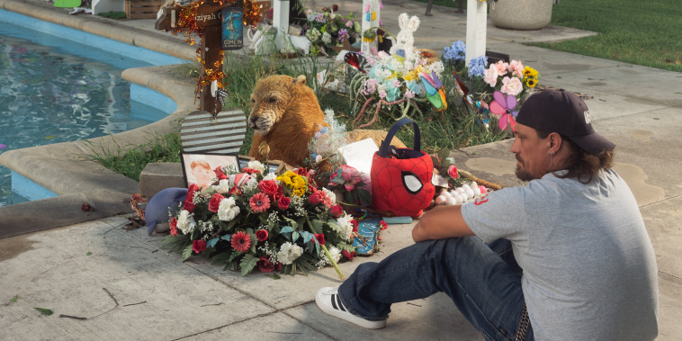 Brett Cross, who’s son Uziyah Garcia was killed in last year’s massacre at Robb Elementary School, sits near a memorial for his son in the Uvalde Town Square in Texas on April 25, 2023.